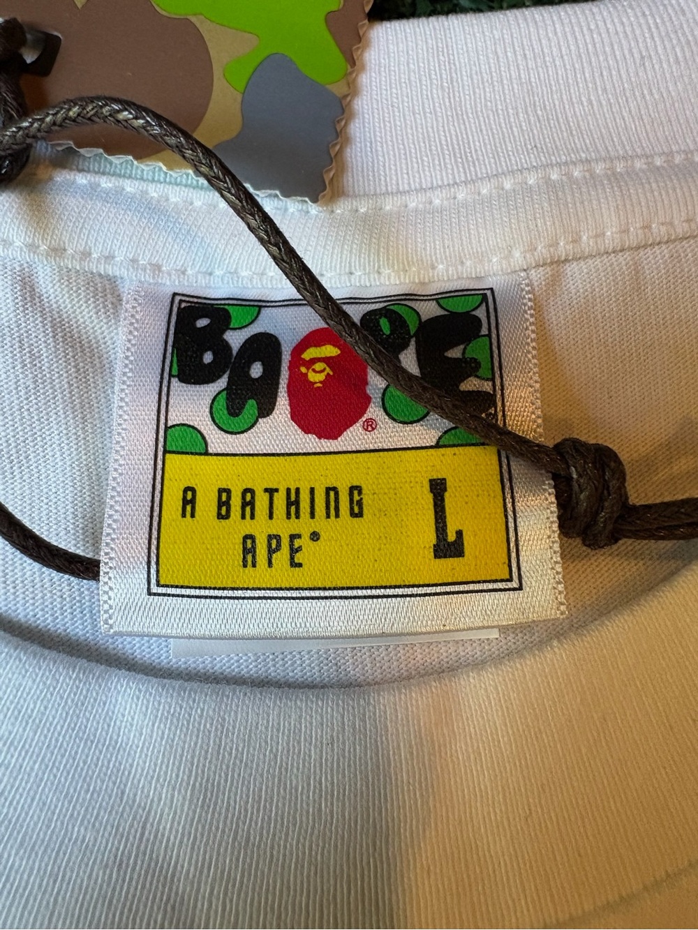 A Bathing Ape White Short Sleeve Tee with Blue/Green Camo Ape Head - Picture 7 of 9